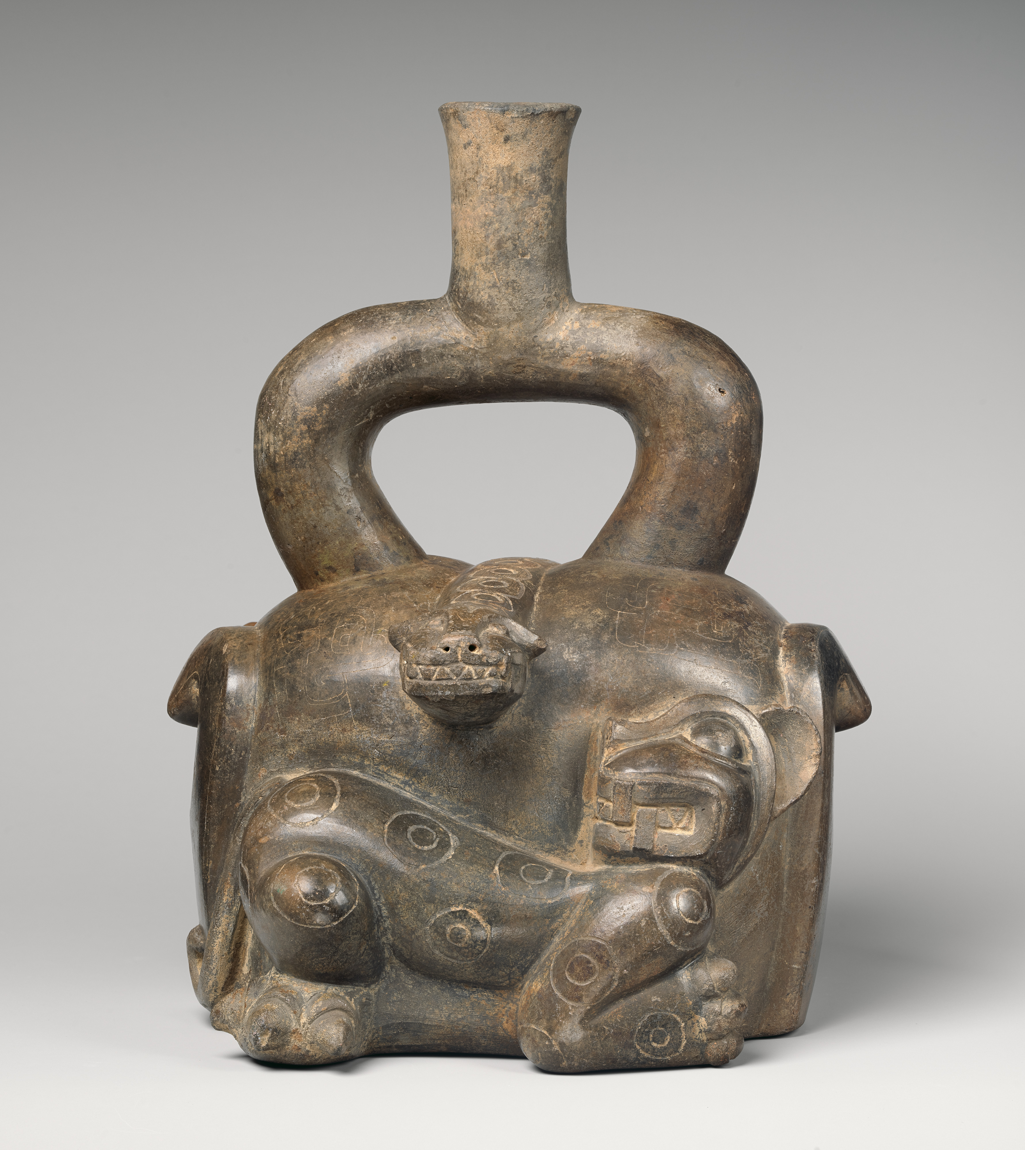 Stirrup-spout bottle with feline and snake